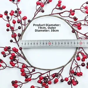 Detail showing 38cm Christmas wreath with red berries and size measurements on white background