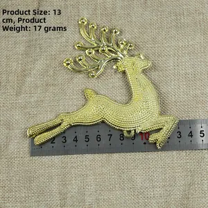 Detail of 13cm golden reindeer Christmas ornament with size and weight measurements