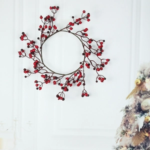 Christmas wreath with two-tone red berries and lifelike pomegranate fruit for wall decor