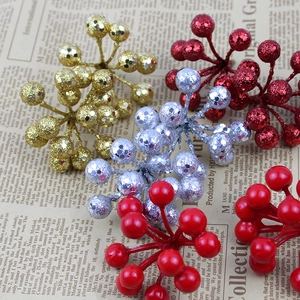 Artificial Christmas berry picks in glitter gold and red for festive wreath decoration