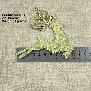 Golden reindeer Christmas tree ornament with glitter finish and measuring ruler detail