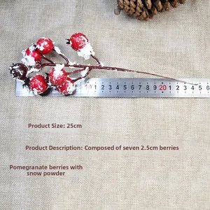 Detail view of 25cm artificial red berries with snow powder for Christmas decor