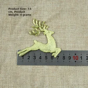 Detail shot of a 7.5cm gold glitter reindeer ornament for Christmas tree decoration