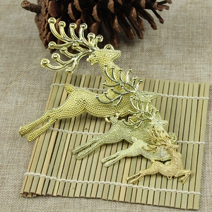 Detailed view of three gold textured reindeer figurines for Christmas tree decoration