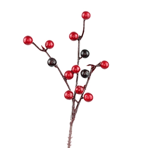 Artificial red and black berry stems for Christmas tree decoration on white background