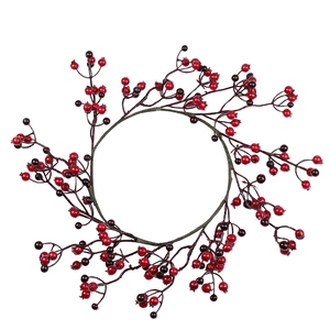 Christmas wreath with bicolored red and purple berries for home festive decoration