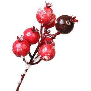 Artificial snowy holly berry branch with red and dark fruits for Christmas decoration