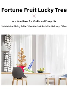 Close-up of golden lucky berry tree centerpiece with festive red fabric base decoration