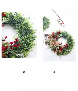 Détail de couronne Fête de l'Indépendance USA avec baies rouges et nœud en toile