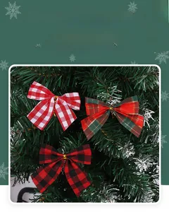 Close-up of assorted red and green plaid fabric Christmas bows on a decorated tree