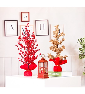 Set of red and gold berry trees with festive vintage lantern for home holiday decor