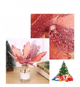 Detail of red glittered Christmas poinsettia with hollow mesh petals and festive sparkle finish