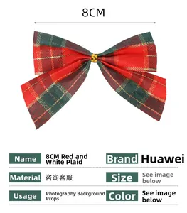 Detail view of 8cm Christmas bow ornament with red green gold plaid fabric pattern