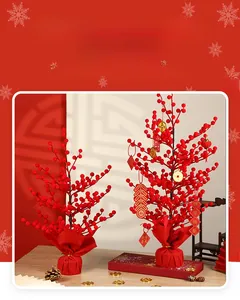 Detail of red festive berry tree with lanterns, gold coins, and traditional New Year tags