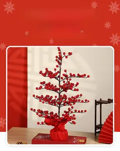 Close-up of festive red berry tree decoration with vibrant berries and red fabric base