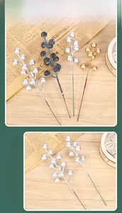 Detail of silver, black and bronze artificial Christmas berries for DIY wreaths and decor