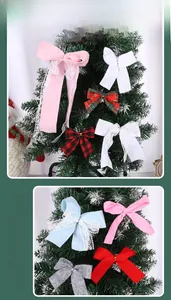 Detail view of colorful festive Christmas bows with lace and plaid for tree decorations