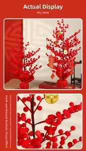 Detail of handmade artificial red berry tree with festive Chinese New Year hanging ornaments