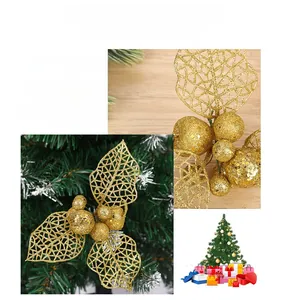Macro detail of golden hollow Christmas flower with glitter mesh petals and berries