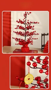Close-up of red berry tree with gold coin pendant for Lunar New Year decor