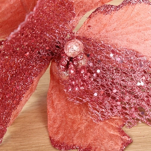 Red poinsettia Christmas tree flower decoration with glitter petals and sequins