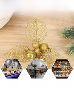 Detail of golden glitter artificial hollow leaf and berries for Christmas DIY decor