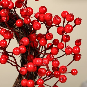 30cm Christmas wreath featuring vibrant red berries on a natural brown rattan base