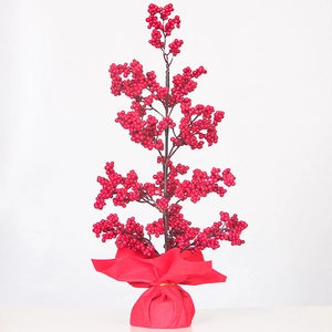 Artificial red holly berry festive tree with red fabric base for New Year decoration