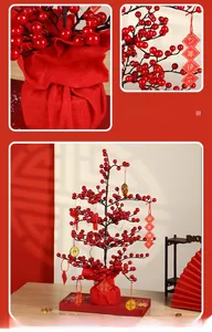 Close-up of red berry tree ornaments with traditional Chinese New Year gold coin pendants