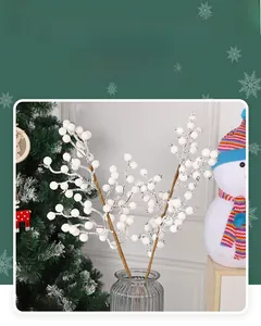 Close-up of artificial white berries in a grey glass vase for Christmas home decoration