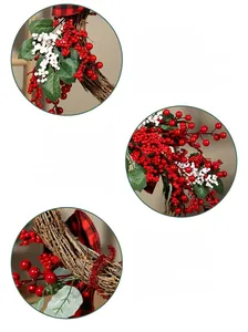 Detail of Christmas wreath with red berries, pine leaves, and black-red checkered bow