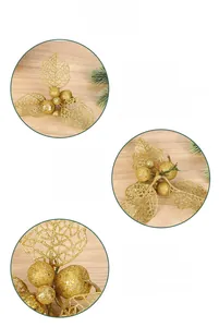 Detail of glittered golden hollow leaves and berry stems for Christmas DIY decoration