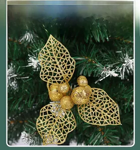 Detail of champagne gold glitter holly leaves and berries for Christmas tree decoration