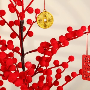 Artificial red berry tree with golden lucky charms for Chinese New Year festive decor