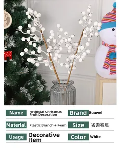 Detail of white snowy Christmas berry branch in a glass vase with winter decor