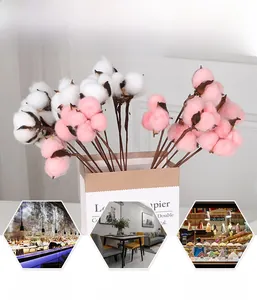 Detail of faux pink and white cotton flower branches in a paper bag for home decor