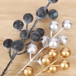 Handcrafted artificial Christmas berries in silver, gold, and frosted black for DIY wreaths