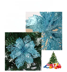 Close-up of dark blue hollow Christmas poinsettia flower with sparkling glitter texture