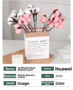 Detail of 20cm artificial white and pink cotton flower branch in a decorative paper bag