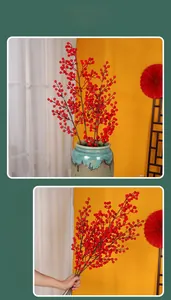 Close-up of vibrant red artificial berries for festive Chinese New Year flower arrangements