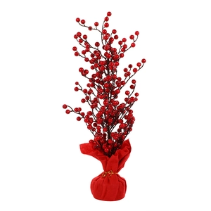 Artificial red berry tree decoration with festive red fabric base for New Year
