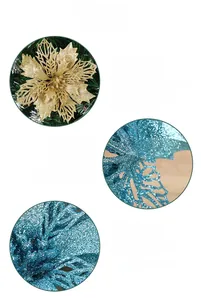Detail of glittered poinsettia ornaments with hollow design for Christmas tree decoration