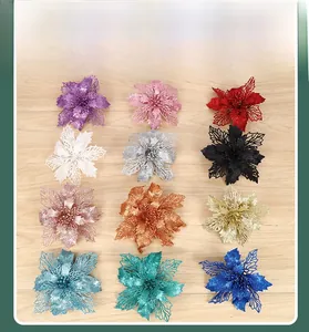 Grid view of 12 glitter hollow Christmas flowers in various colors on wood background