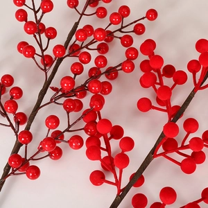 Red artificial berry stems for New Year decor featuring glossy and matte finishes