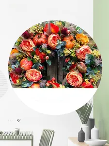 Detailed view of autumn wreath featuring realistic pumpkins, roses and colorful berries