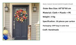 Detail of handmade autumn pumpkin wreath with roses and PE foliage for harvest festival