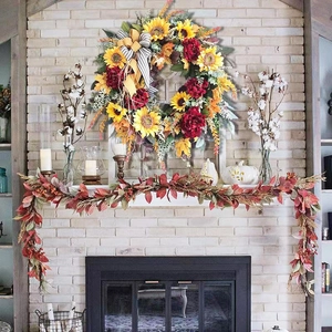 Autumn sunflower wreath with red flowers and striped bow for home fireplace decor
