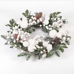 Winter Christmas wreath with white berries and natural pine cones on white background
