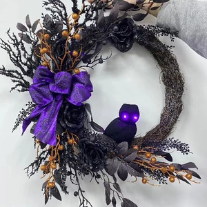 Halloween black wreath with purple owl featuring glowing eyes and dark roses