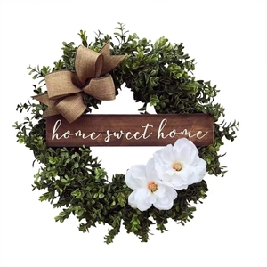 Artificial eucalyptus wreath with white flowers and 'Home Sweet Home' wooden sign
